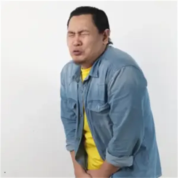 Man in evident physical discomfort.